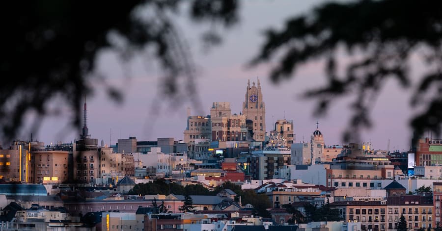Beautiful cityscape of Madrid, Spain, captured during twilight with iconic landmarks visible.